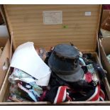 A case of textiles, the lot to include a 19th century postman's hat