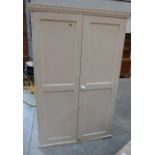 A painted pine wardrobe enclosed by a pair of panel doors. 45' wide
