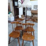 A beechwood lamp standard and a set of four kitchen chairs