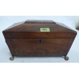 A Regency mahogany sarcophagus tea caddy with brass line inlay, on gilt brass paw feet. 12' wide