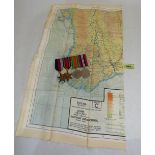 WW2. A group of four service medals together with a silk map of Burma.