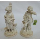 A pair of 19th century parian figures of a shepherdess and male companion. 8½' high. Damage and