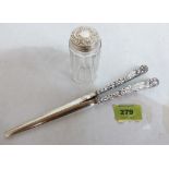 A pair of silver hafted glove stretchers and a silver topped dressing table jar