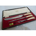 A Victorian carving set, the knife blade marked Petty's Celebrated, Sheffield, in later case