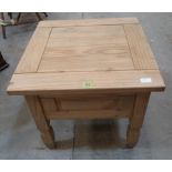 A pine low table on square legs. 23' wide