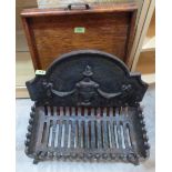 A cast iron fire grate with back 20' wide, together with an oak tray