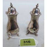 A pair of George V silver pepperettes. London 1915. 3ozs 12dwts