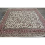 An English carpet, 9'3' x 9'3'