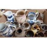 A collection of pottery and other ceramic jugs. Prov: Estate of Islwyn Watkins