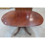 A 19th century mahogany snap-top breakfast table on quadripartite support. 57' long