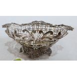 A Victorian silver reticulated ovoid bowl, cast with flowers, foliage and scrolls. London 1890.