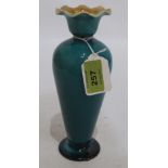 A Linthorpe jade green glazed inverted baluster vase. 8' high. Neck re-stuck