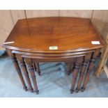 A nest of three mahogany bow-fronted occasional tables