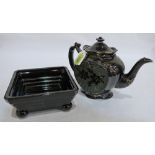 A black glazed and gilded teapot together with a black opaque glass square bowl