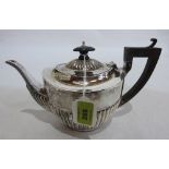 A George V silver half gadrooned teapot. Birmingham 1912. 13ozs inclusive