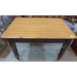 A Victorian painted pine kitchen table with frieze drawer. Formica cover to top. 48' long