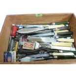 A box of assorted cutlery