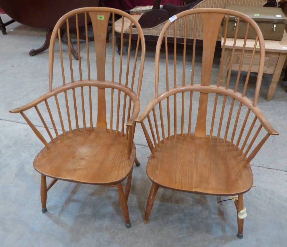 A pair of Ercol 'Craftsman' Windsor elbow chairs