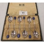 A George V cased set of six silver coffee spoons with glass bean terminals. Liberty & Co. Birmingham