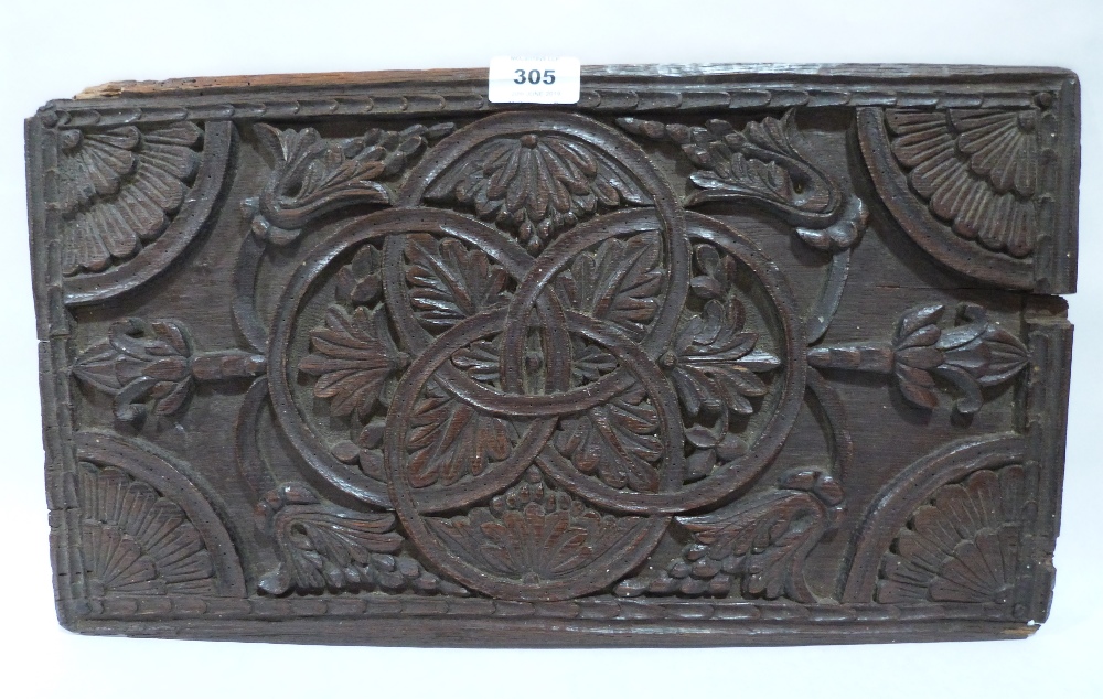 A 17th/18th century Scottish oak panel, carved with foliage and interlinked circles. 18' x 10'