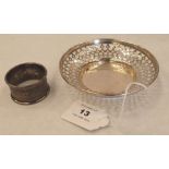 A George V silver pierced dish, 4½' diam, Birmingham 1911 and a silver napkin ring, Birmingham 1923.