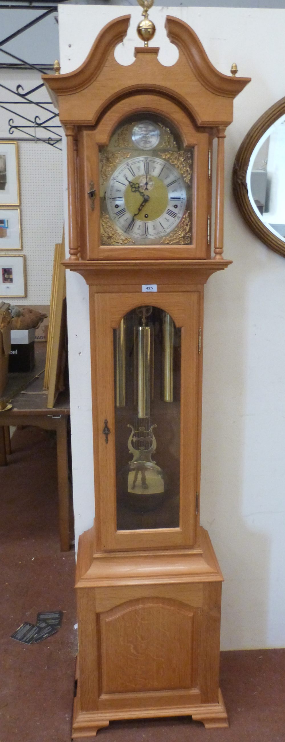 An oak longcase clock of recent manufacture, the three train weight driven movement striking and