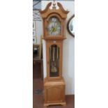 An oak longcase clock of recent manufacture, the three train weight driven movement striking and