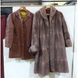 A lady's tan leather half length coat and a fur coat