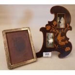 A silver photograph frame and a marquetry frame