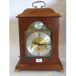 A walnut bracket clock of recent manufacture, the three train German movement striking and chiming