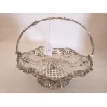 A silver plated pierced fruit basket, the shaped rim moulded with vine fruits. 10¾' diam