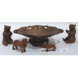 A 'Black Forest' musical dish carved with vine fruits; a pair of carved bears and two hounds