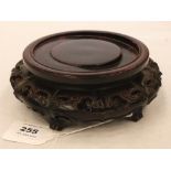 An oriental rosewood pot stand, pierced and carved with ruyi. 6½' diam