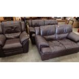 A three piece suite, upholstered in brown leather, comprising a pair of two seater sofas and a