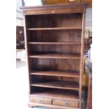 An oak open bookcase with five adjustable shelves over a pair of base drawers. 78' high