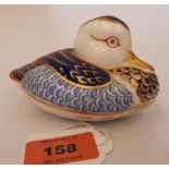 A Royal Crown Derby duck, painted in coloured enamels and gilded. 4½' long. Gold stopper