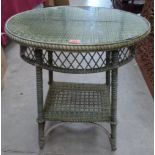 A wicker two tier centre table