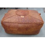 A leather footstool