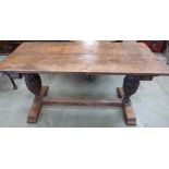 A 19th century Jacobean style oak refectory table, the two plank top raised on cup and cover bulbous