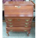 A yew wood bureau of recent manufacture on cabriole legs. 27' wide