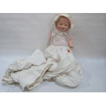 An Armand Marseilles baby doll with composition body, the bisque head with open mouth and sleeping