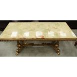 A gilt brass low table in onyx top. 48' long
