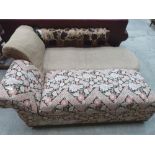 A Victorian walnut chaise-longue and an ottoman day bed. Both for re-upholstering