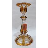 A 19th century amber flashed glass candlestick. 9' high