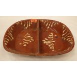 An English pottery divided rectilinear dish with trailed slip decoration. 13½' wide