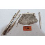 A silver chain mail evening purse, two silver propelling pencils, a white metal example and a