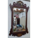 A mahogany fret carved pier glass, the surmount carved with a ho-ho bird. 36' high