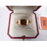 A Cartier ring, set with step cut honey citrine. In gold marked 750. 14g gross. Size O