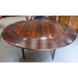 A Danish 'Dyrlund' rosewood 'Flip Flap' Lotus dining table, extending with four sliding and