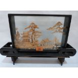 A Chinese cut cork diorama landscape, the case raised on a stand. 11½' high